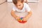 A child with a colorful pop it game. Anti-stress. Popular Relaxing rhomb shape silicone stress relief toy. Games for children duri