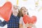 Child couple with balloon hearts