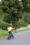 Child cycling on a path