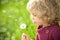 Child with dandelion