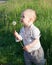 Child with dandelion