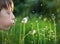 Child and dandelions