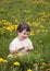 Child in dandelions