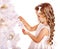 Child decorate Christmas tree .