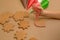 Child decorates gingerbread with icing