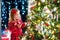 Child decorating Christmas tree