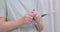Child delightfully playing with homemade purple slime, stretches slime to the sides, an engaging sensory activity