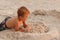 Child destroy sand castle.