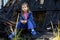 A child and destroyed house. Little girl near the burnt home after bomb attack