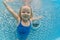 Child dive in pool, jump deep down underwater from poolside