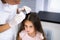 Child Doctor Checking Head Hair