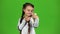 Child does selfie. Green screen. Slow motion
