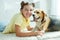 Child with a dog. Teenage girl with a beagle dog at home.