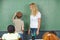 Child doing math in chalkboard