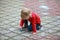 Child drawing with chalk