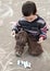 Child drawing with chalk