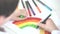 Child drawing a rainbow