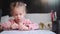 Child drawing sharpening pencils sitting on table middle shoot. Caucasian female little girl draws with colored pencils