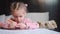 Child drawing sharpening pencils sitting on table middle shoot. Caucasian female little girl draws with colored pencils