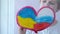 The child dreams of peace and friendship. friendship concept. The child draws the flags of Russia and Ukraine on the