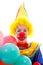 Child dressed as colorful funny clown