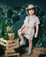 child dressed in the style of a jungle treasure hunter with a hat