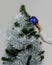 Child dresses up Christmas tree