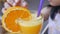 child drinking a glass of orange juice .