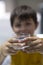 Child drinking a glass of pure water