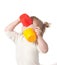 Child drinks juice from a mug.