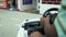 Child driving car in game center close up.