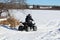 Child Driving His Quad Onto a Frozen Lake