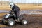 Child driving through mud on his quad