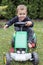 Child driving toy tractor