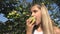 Child Eating Apple, Kid in Orchard, Farmer Girl Studying Fruits in Tree