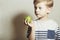 Child eating apple.Little Boy with green apple. Health food. Fruits. Enjoy Meal