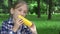 Child Eating Boiled Corn Outdoor in Park, Hungry Girl Eats Healthy Snack Food 4K