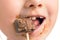 Child eating chocolate lollipop