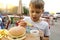 Child eating fries with ketchup