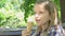 Child Eating Ice Cream at Playground, Kid Relaxing, Sitting on Bench in Park