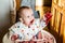 child eating in a kitchen