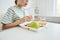 Child Eating Lunch in Hospital Room