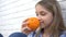 Child Eating Oranges Fruits at Breakfast, Girl Kid Smelling Healthy Food Kitchen