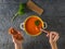 The child eats cream soup and toasted toast with sun-dried tomatoes. Flat lay.