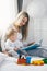 Child education. Happy mother with her toddler sitting on the bed and reading a book