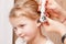 Child ENT check - doctor examining ear of a little girl with otoscope