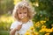 Child explorer flowers in garden