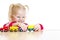 Child in eyeglasses playing toy train isolated