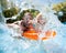 Child with father in swimming pool