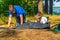 Child with father to install tent